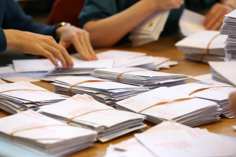 Decorative image of votes being counted