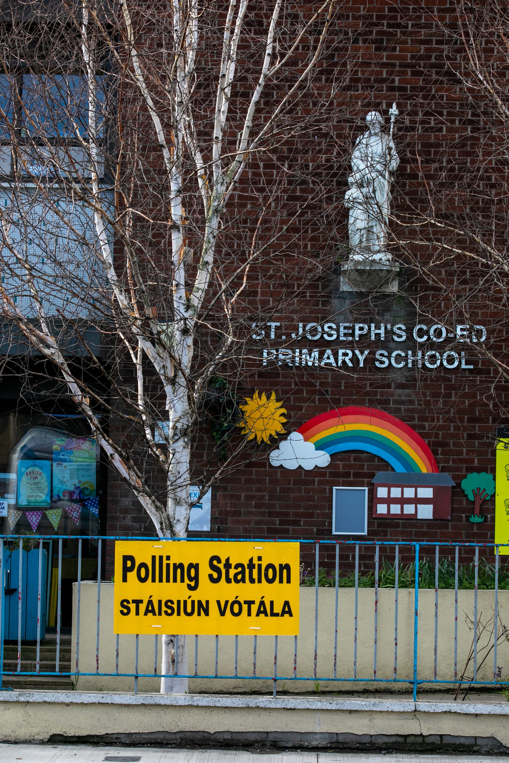 Image of polling station with directional signage outside